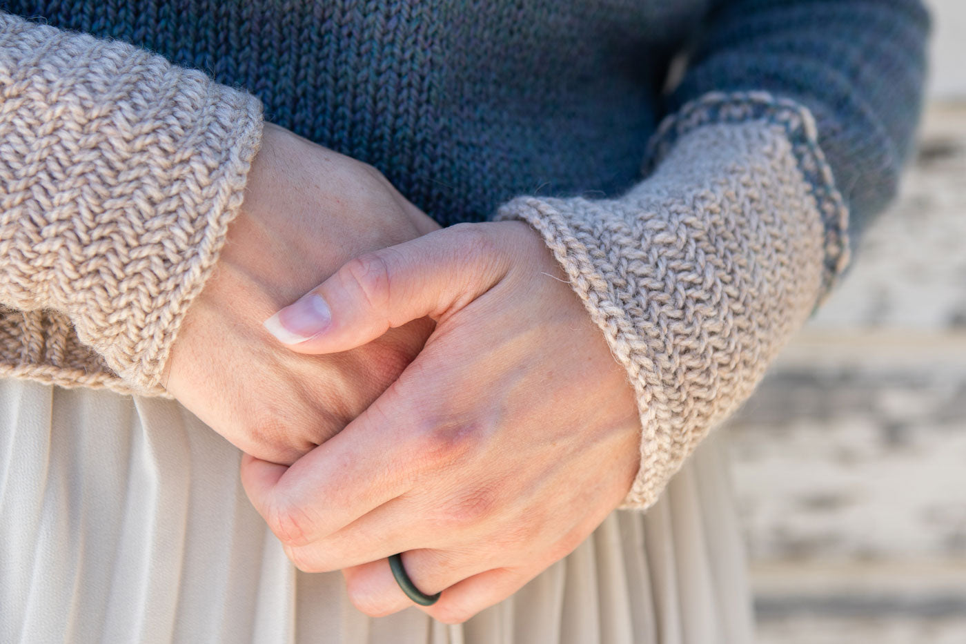 This is a close up image of the herringbone design detail on the sleeves of Flavia's Sprout Pullover