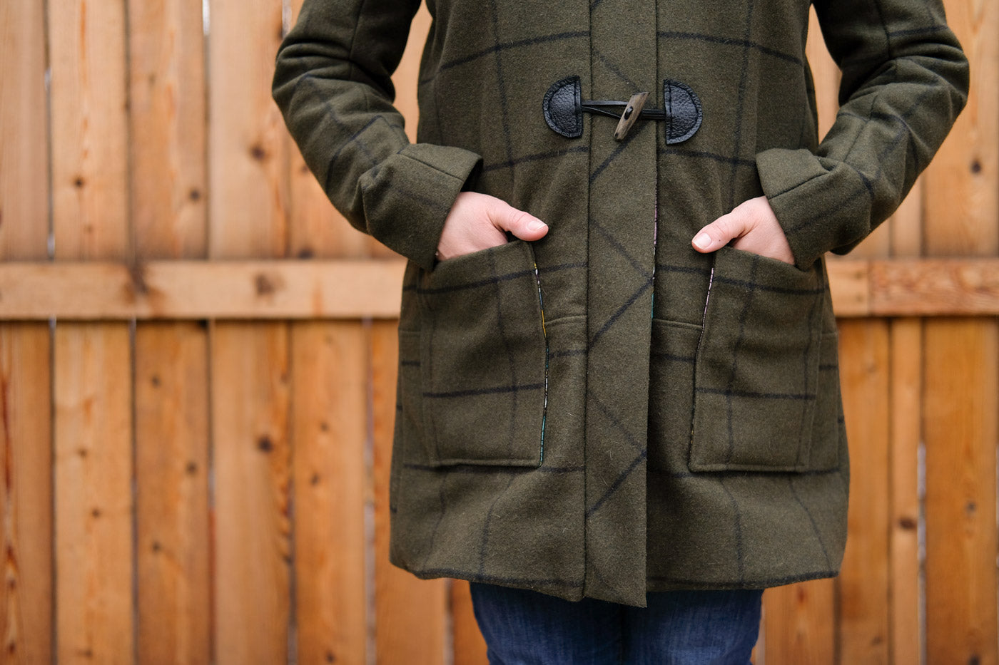 Hands in patch pockets of the Grainline Studio Cascade Duffle Coat