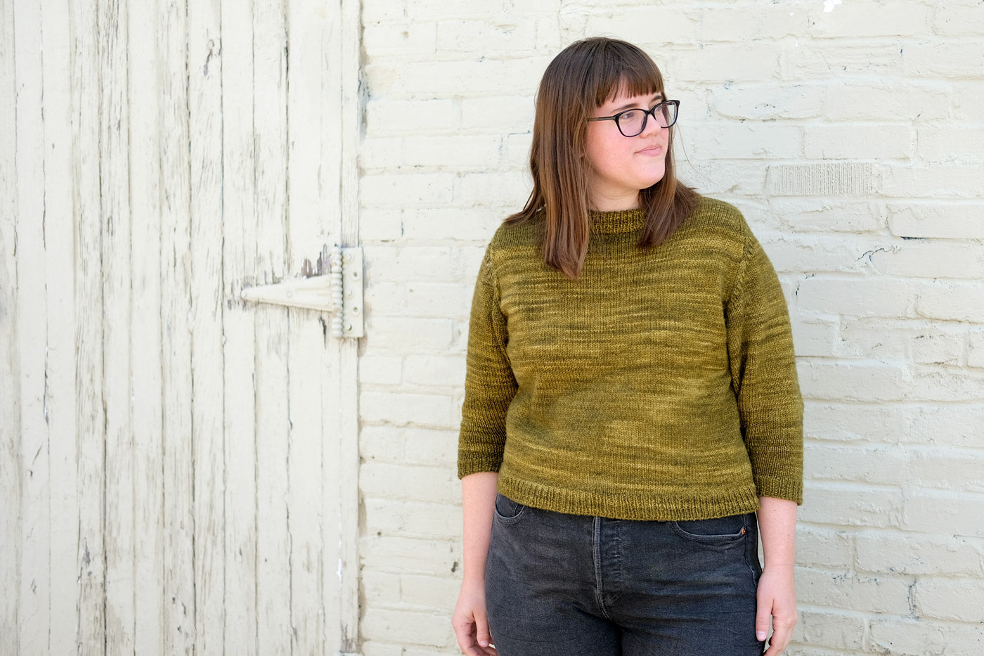 Kaylee Lockhart in her green-yellow MadelineTosh DK Cline Sweater