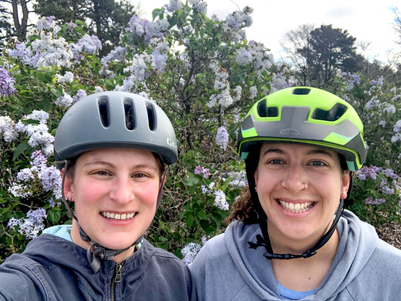 Two women in bike helmets