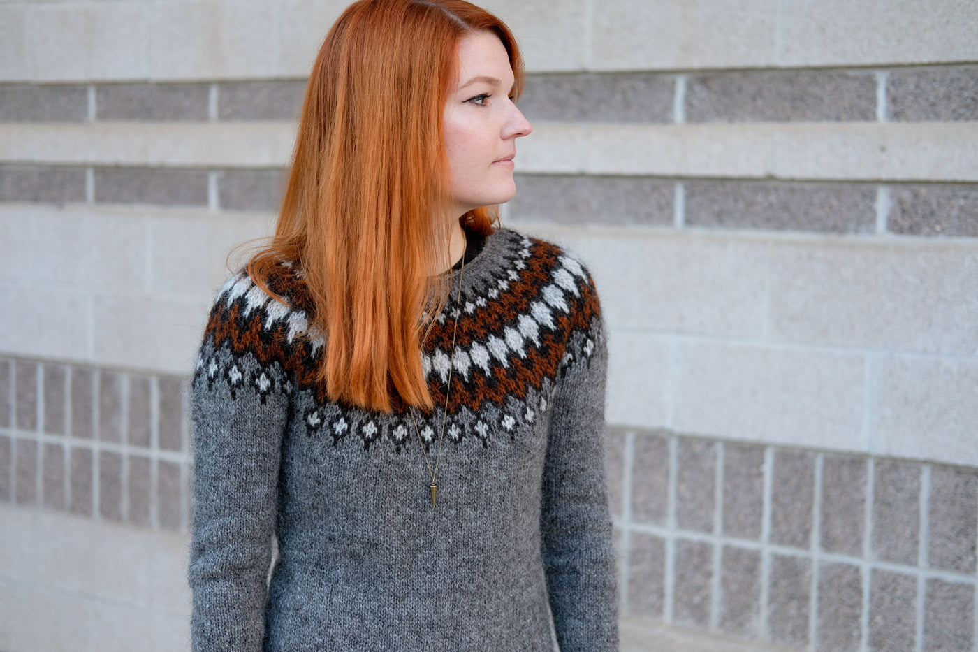 Lauren in her grey and red colorwork pullover sweater