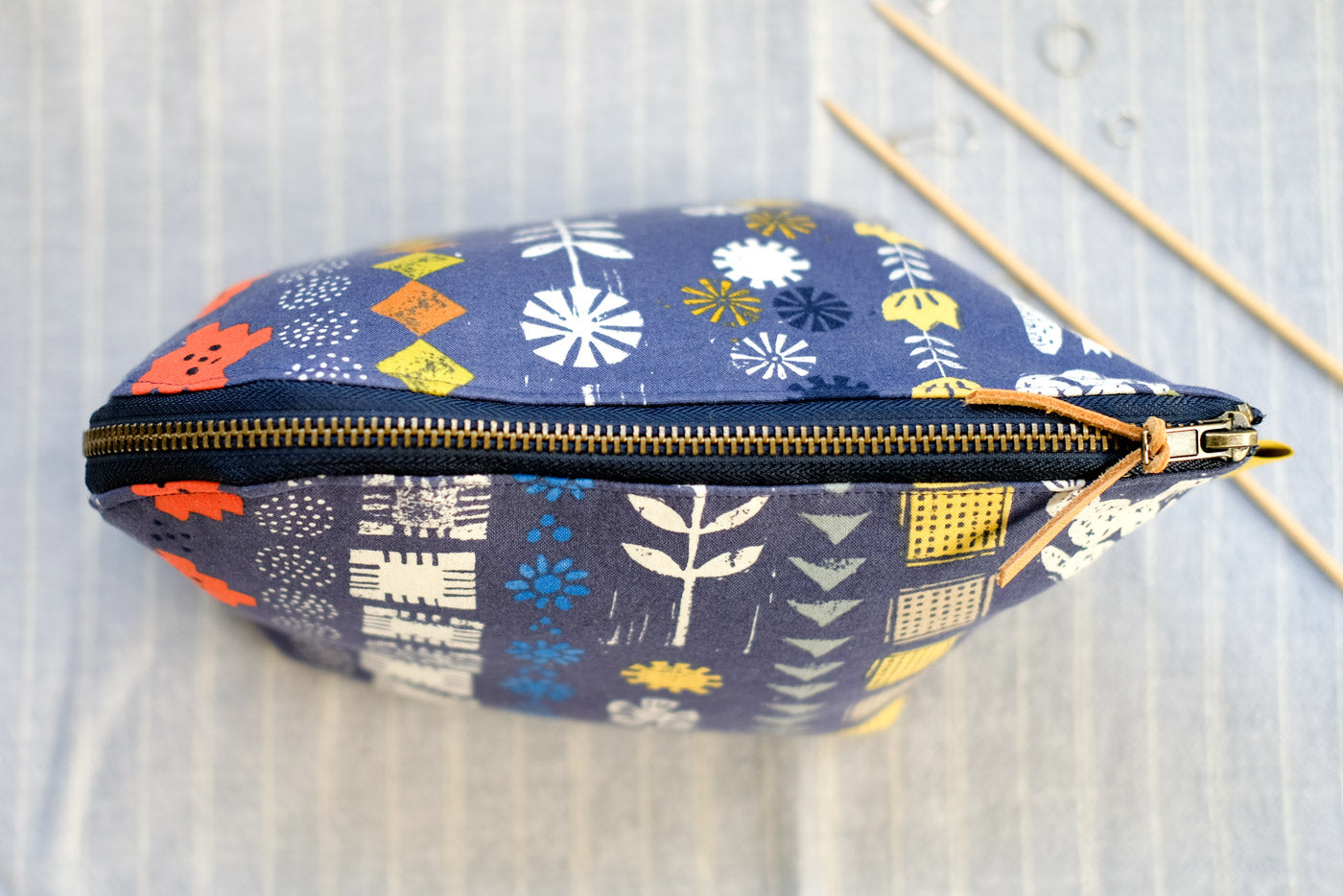 Closed, top-view of the Open Out Box Pouch by Aneela Hoey