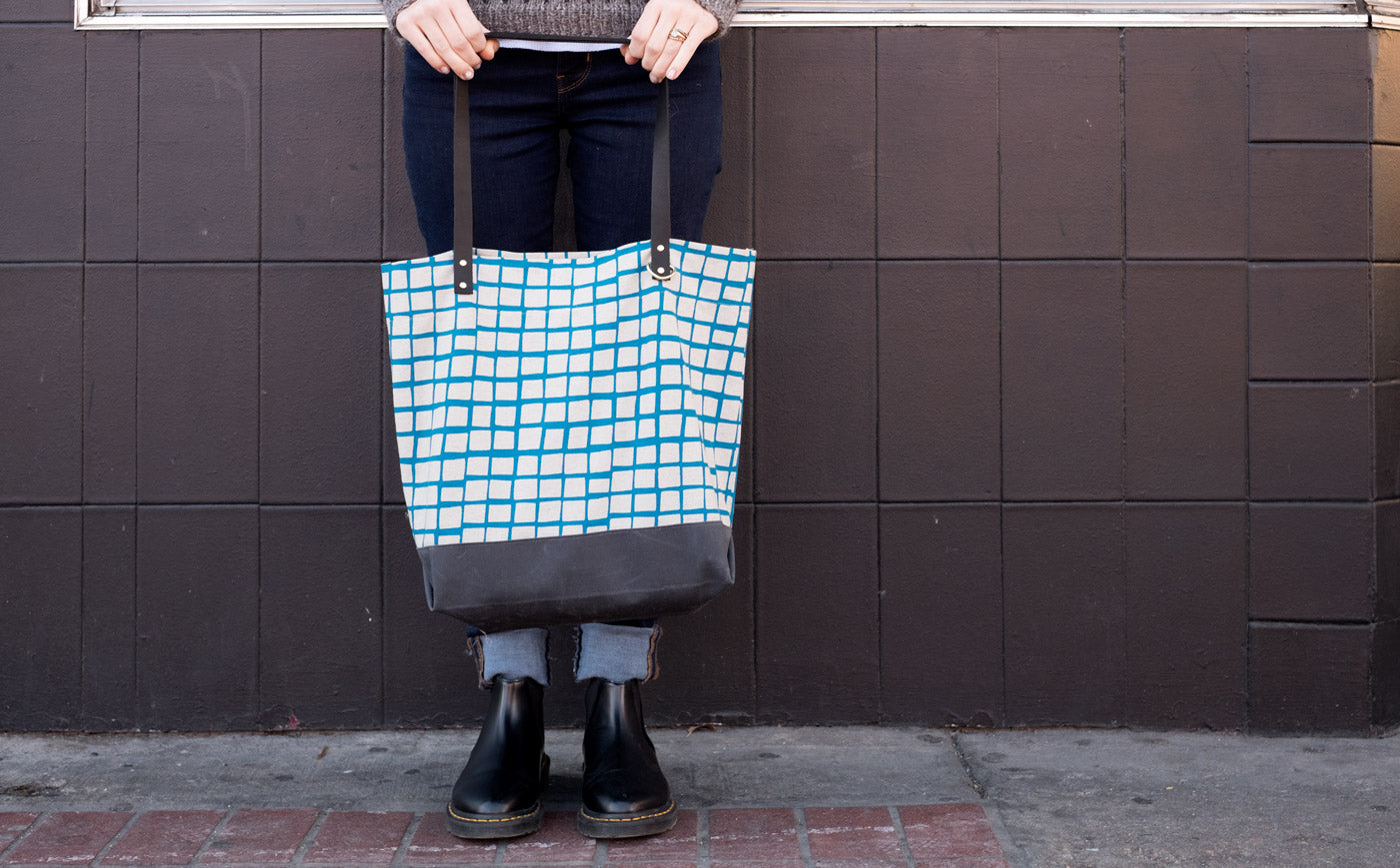 Hands Holding Katy Osterwald's Portsmith Tote