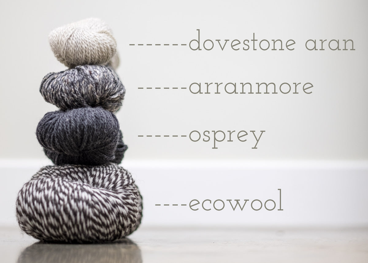 Four skeins of yarn stacked: Dovestone Aran, Arranmore, Osprey and Ecowool