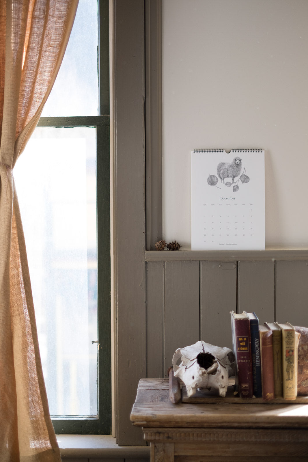 Woolful 2018 wall calendar resting on a ledge