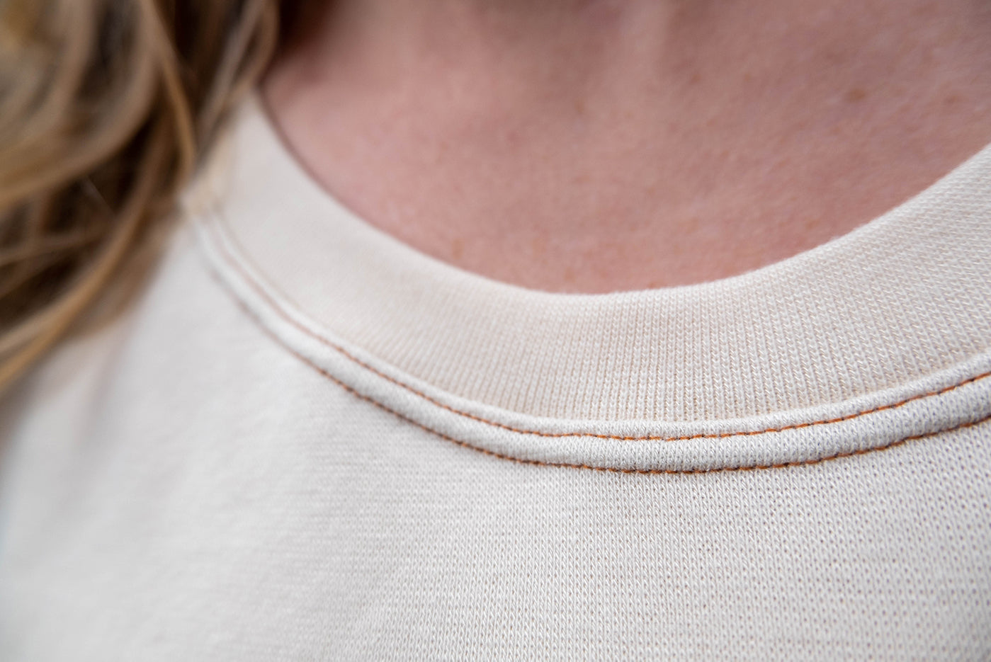 close up view of the knit neckline on amber's sunny top