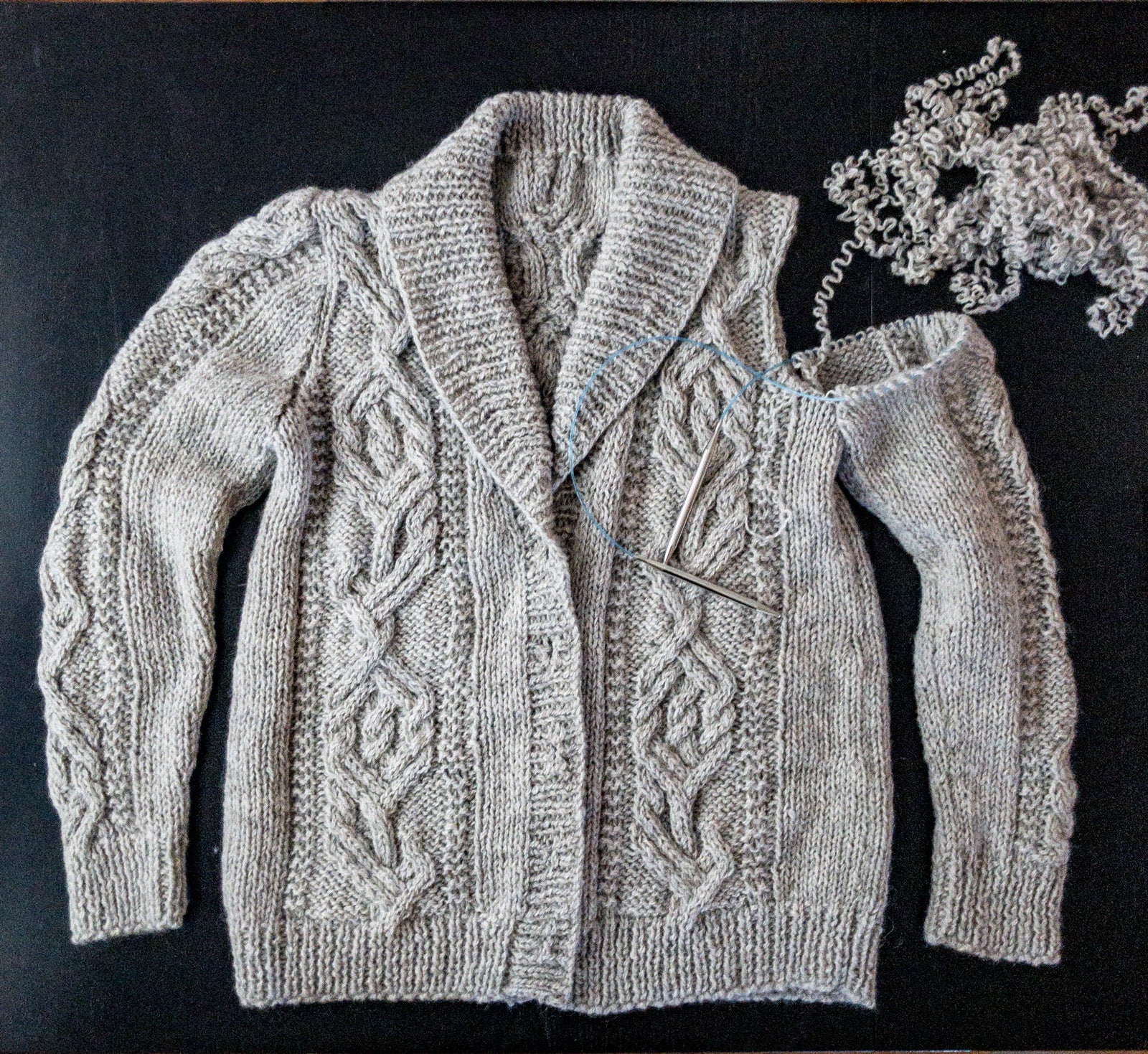 Unraveling the sleeve cap of Jungrass Cabled Cardigan