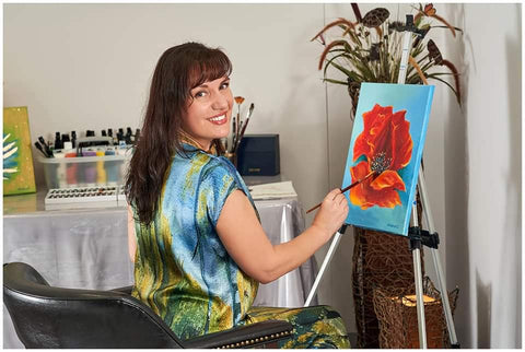 Alesia Chaika fashion designer creating the "Flower Of Inspiration" artwork on canvas at her studio in Buffalo Groe, Illinois, USA