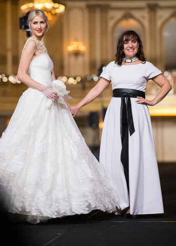 Fashion Designer Alesia Chaika at the Palmer House Hilton Chicago fashion show finale with her model wearing couture wedding gown