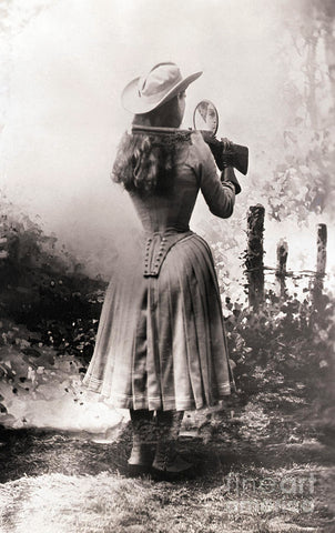 Annie Oakley shooting over a shoulder