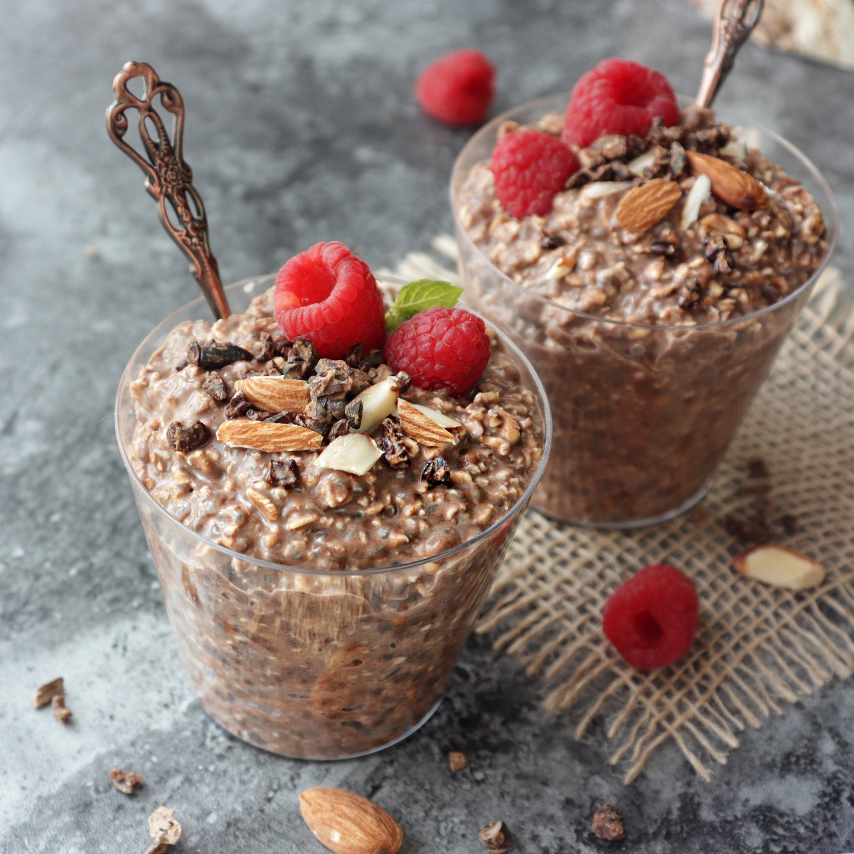 Maca Overnight Oats Topped with Cocoa, Almonds and Raspberries