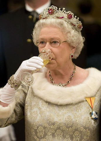 The Queen driving champagne