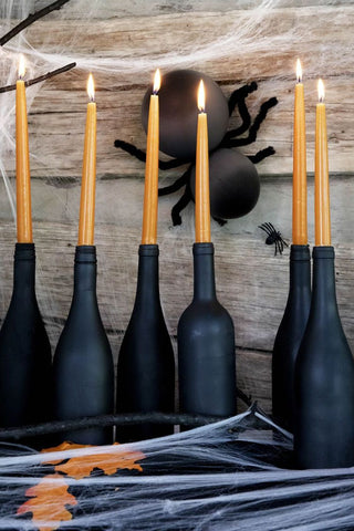 Paint your wine bottles black and use as candle stick holders