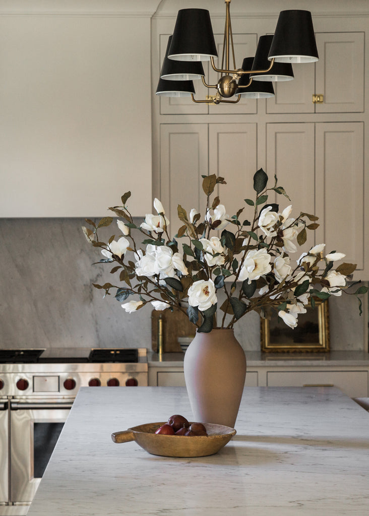 White Magnolia Flowers in Terracotta Vase