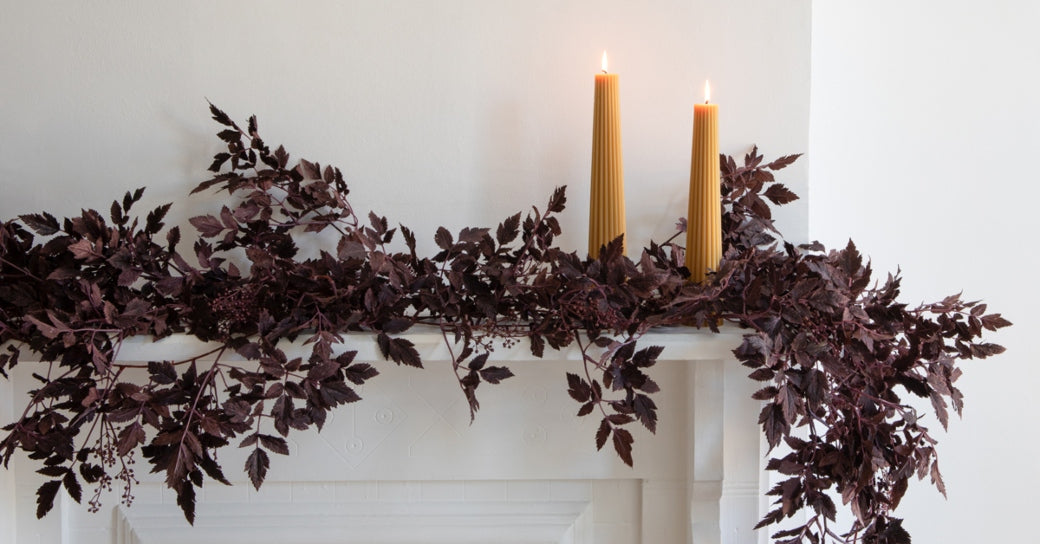 Plum garland on a fall mantle pieces. | Afloral