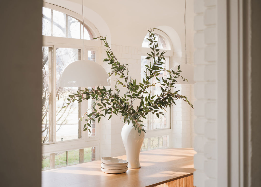 Faux Ruscus Branches in Tall Vase