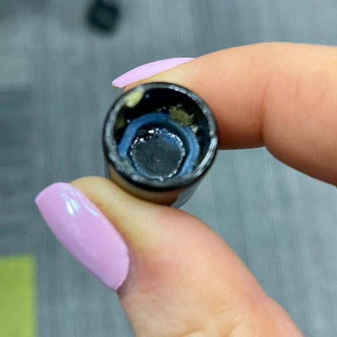 Looking down into a dirty Onyx Atomizer bucket. The Azul core is black in the center.
