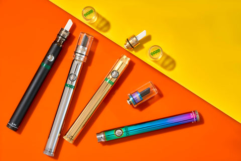 4 Ooze Hot Knife attachments are shown, 3 connected to Ooze Slim Twist Pens and one is laying next to a rainbow battery.