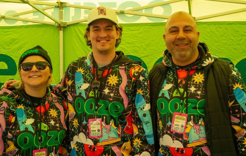 3 Ooze employees wearing All Over Time Warp Hoodies at Hash Bash 2024