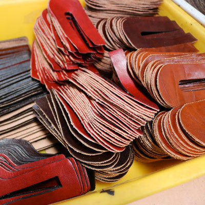 Cutting leather at Floto Leather Bag Factory 