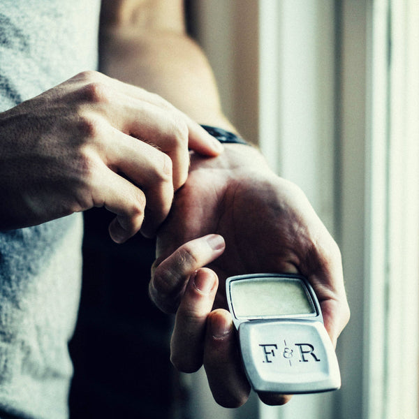 Image of Man using Fulton & Roark solid cologne/fragrance