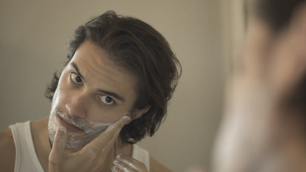 Image of a model washing his face with Fulton & Roark Face Wash 