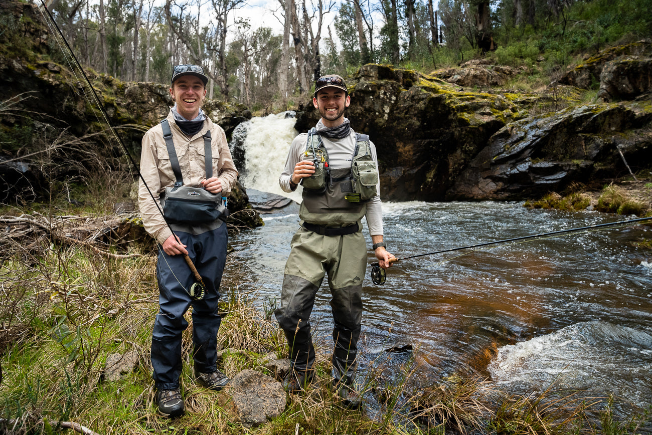 Pat and Dom fly fishing near a waterfall on Yarrangobilly river in Kosciuszko National Park
