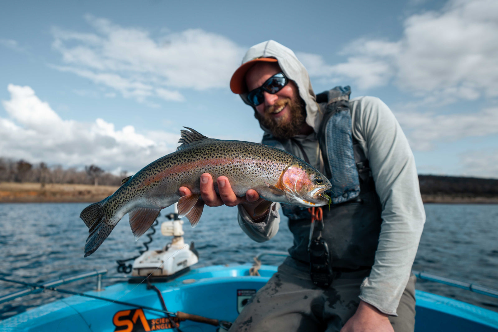 Mickey Finn holding a large rainbow trout caught fly fishing on Lake Eucumbene in the Snowy Mountains