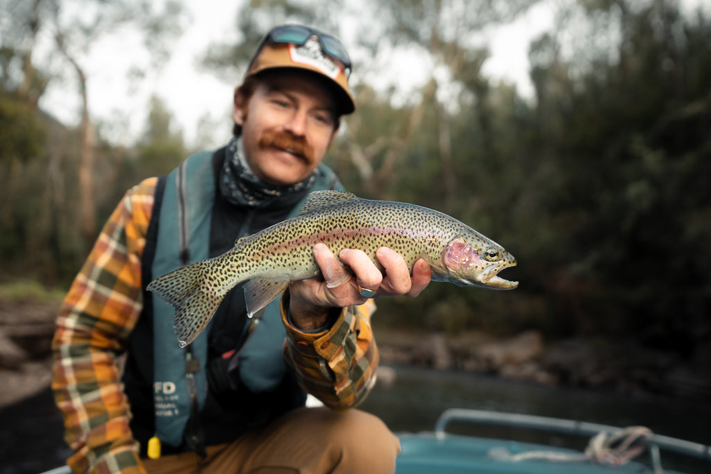 Jack with a snowy mountains rainbow trout