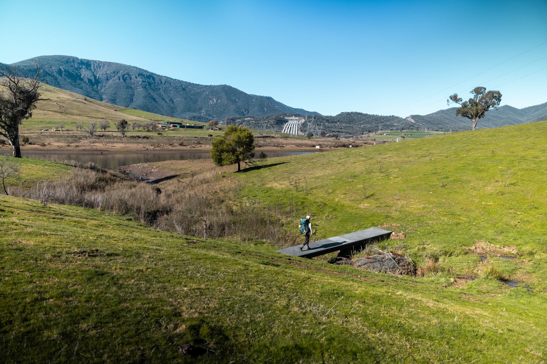 Walking along the Hume and Hovell near Talbingo with the penstocks of Snowy Hydro T3 power station in the background