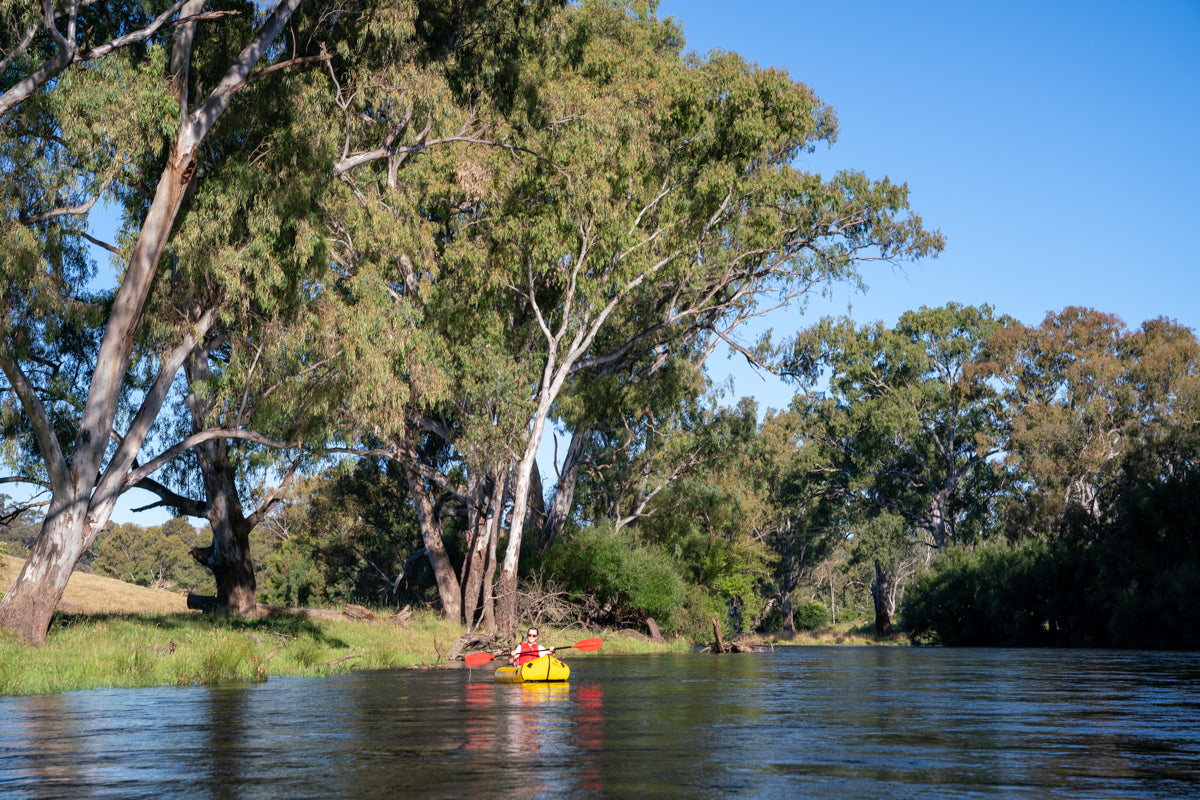 Floating under the gumtrees on a Kokopelli Packraft, down the Tumut River