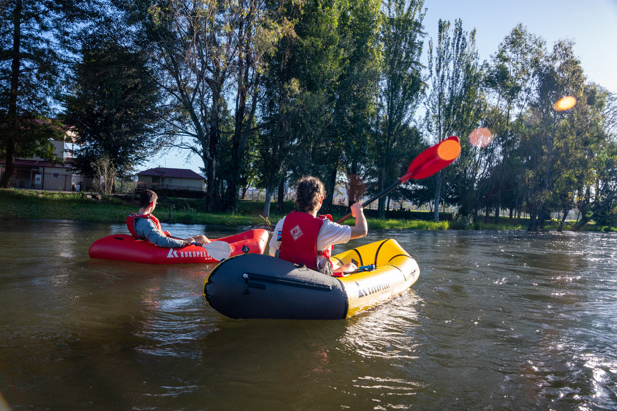 Paddling down the Tumut River on Kokopelli Packrafts, passing the Tumut Racecourse