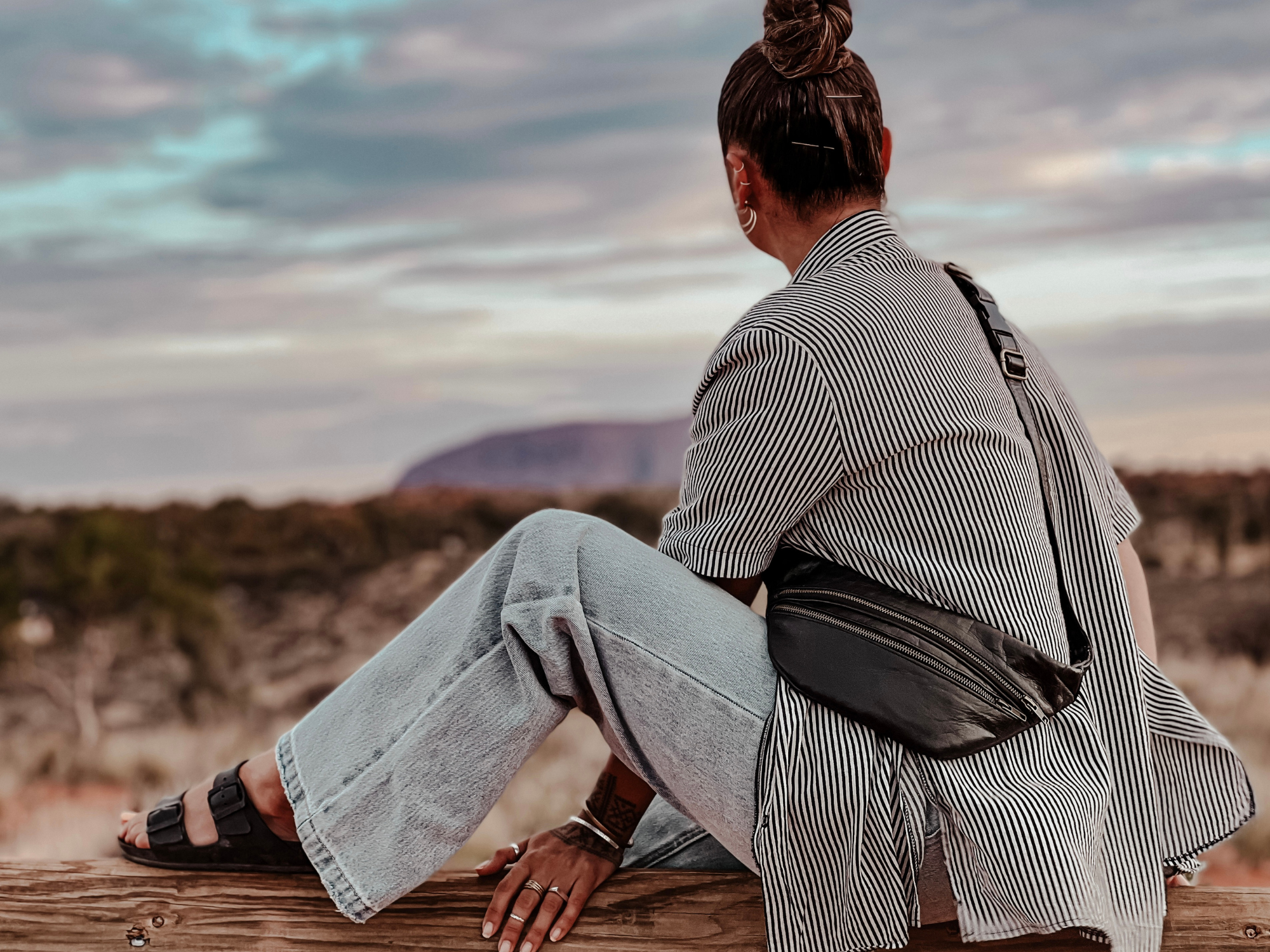 girl wearing crossbody bag at Uluru