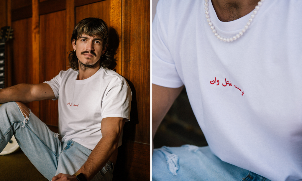 boy wearing Arabic crop in white with red embroidery 