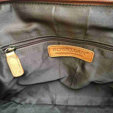 Inside a Rowallan Tan Leather Curved Handbag