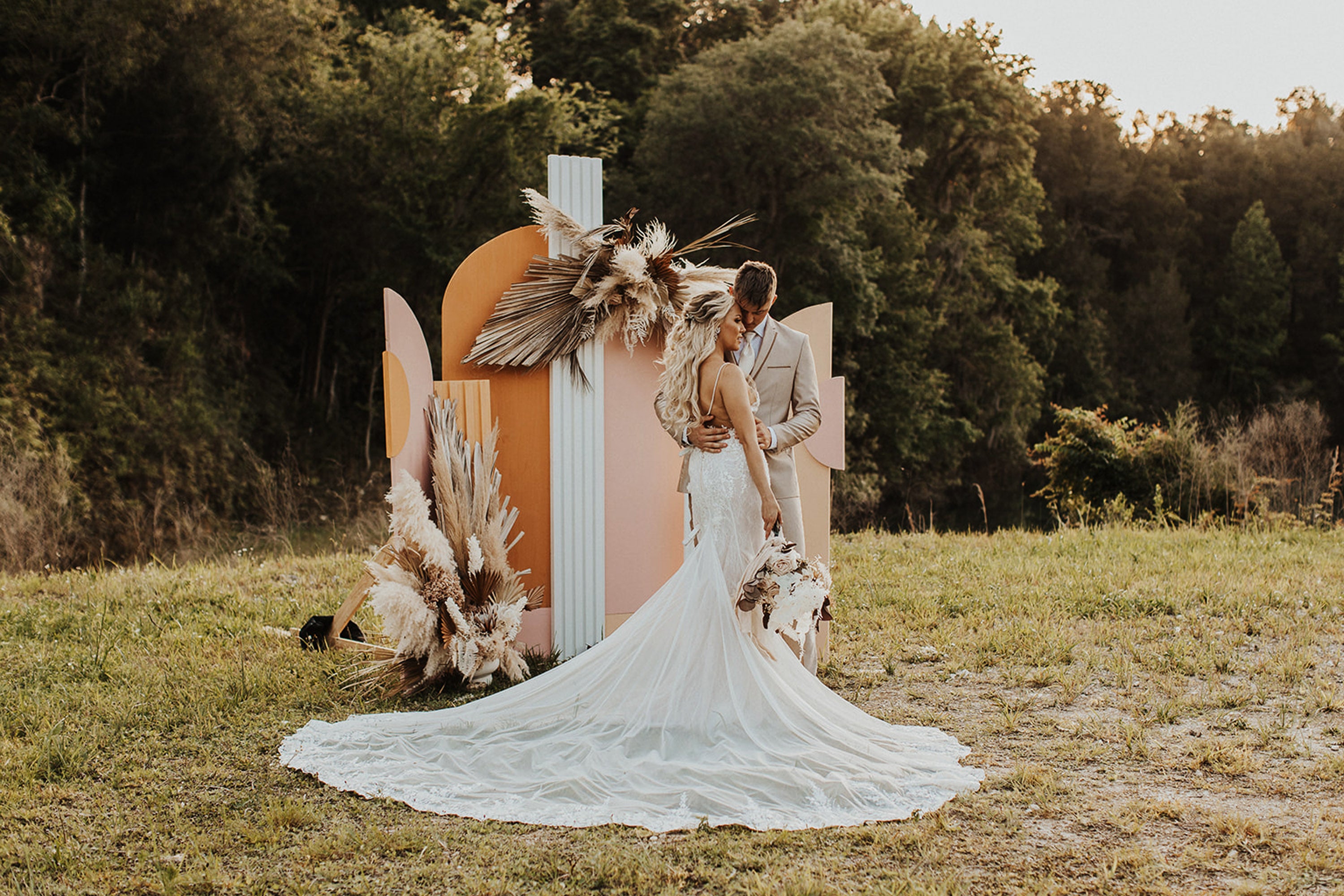 Boho Wedding with Orchids and Dried Palm Leaves Arch Back Drop White Rock Canyon Destination Florida