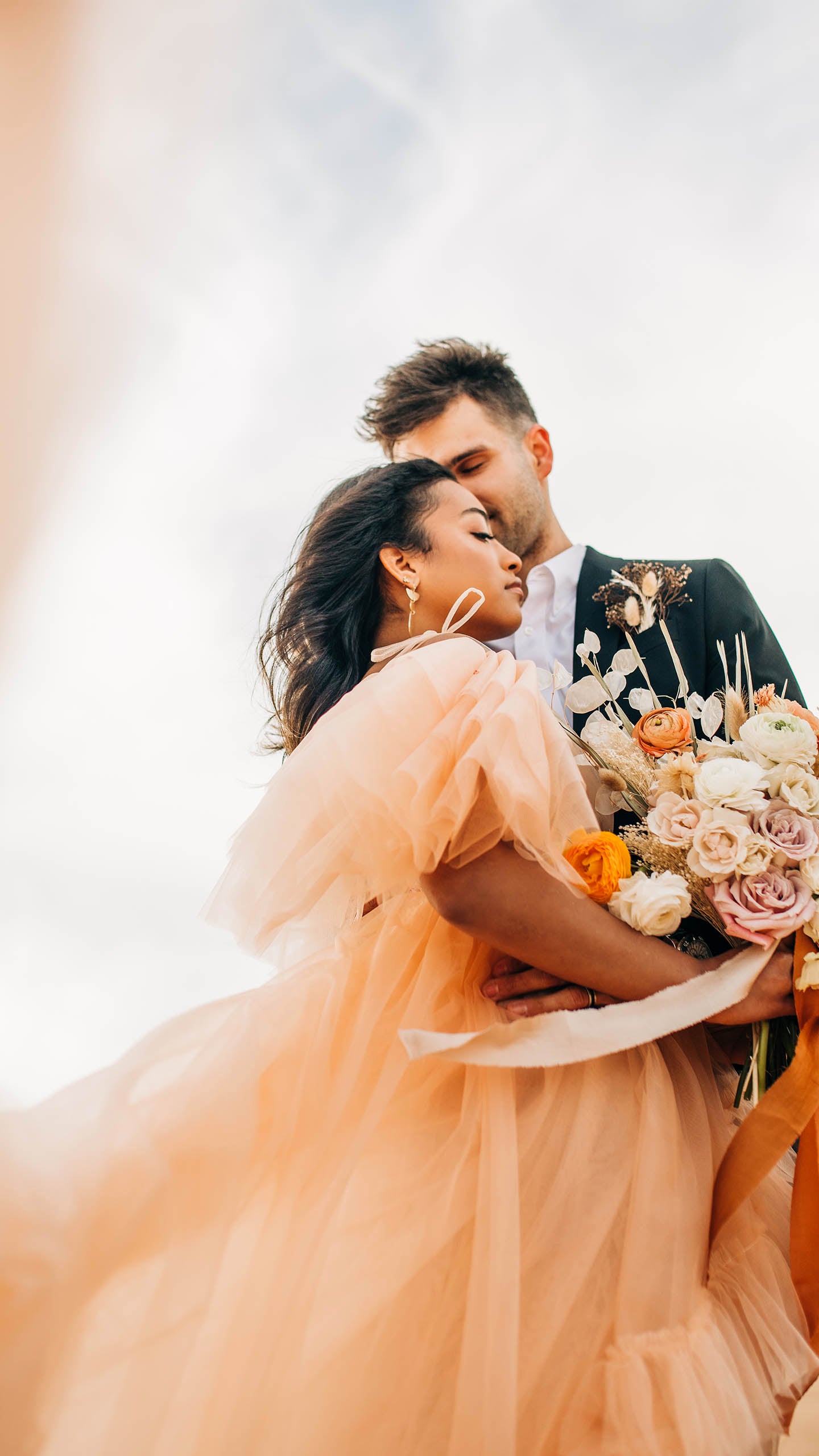 Boho Bride with pale peach dress in desert