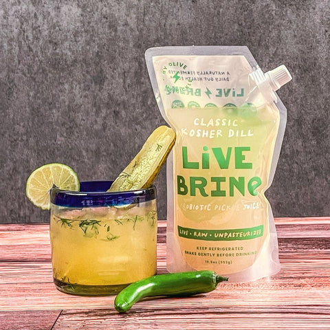 spicy dill margarita drink with pickle juice
