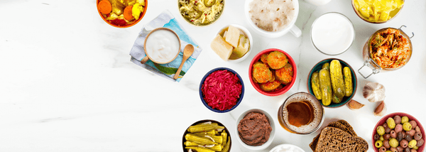 table of probiotic food - sauerkraut and yogurt