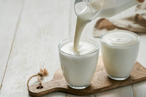 kefir milk pouring into glass