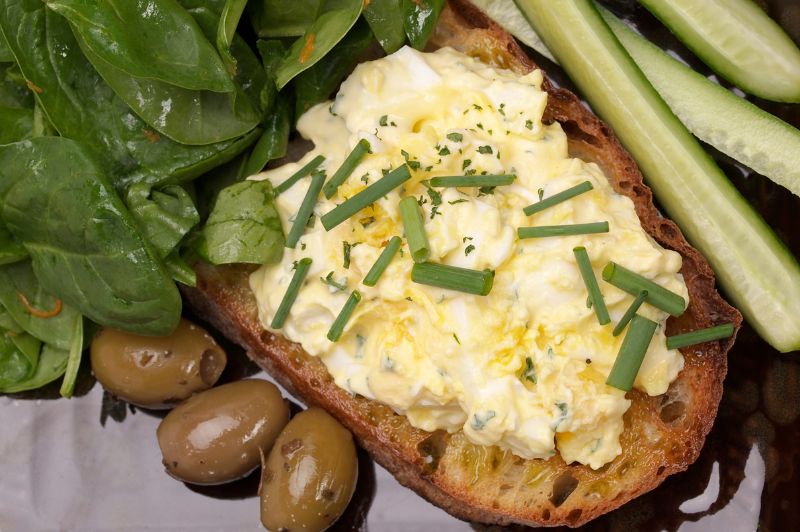 egg salad with olives and cucumbers