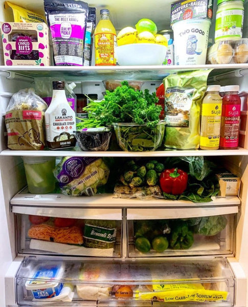 Fridge full of healthy foods, fiber-rich fruits and vegetables, and fermented foods