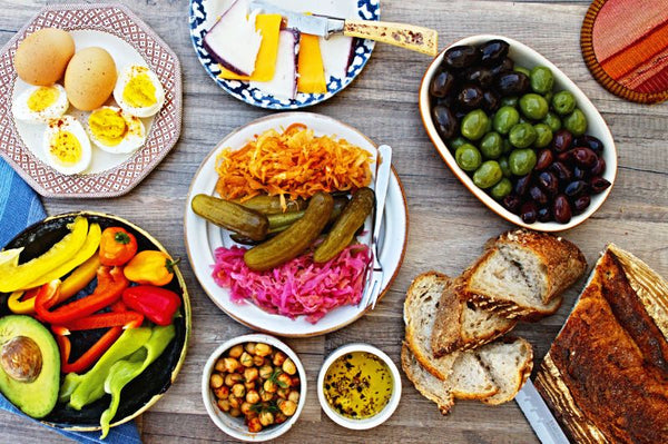 probiotic foods on table, olives, kraut, pickles