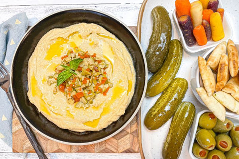 hummus with pickles and olives