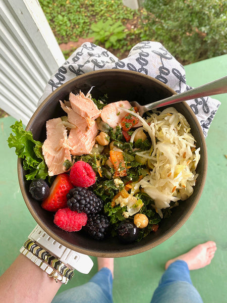 Salad with salmon, berries, and fermented foods