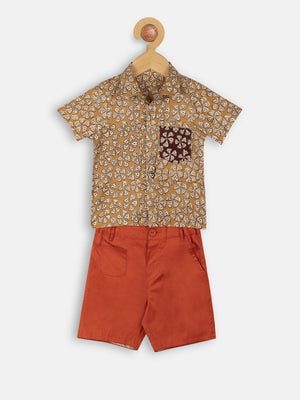 Mustard print shirt with orange shorts