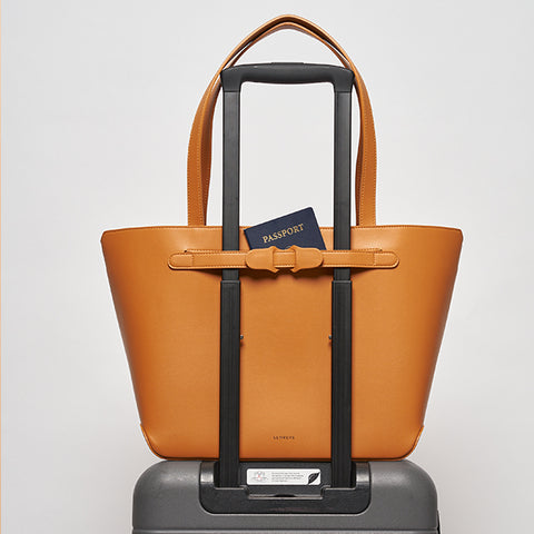 SENREVE travel tote attached to luggage