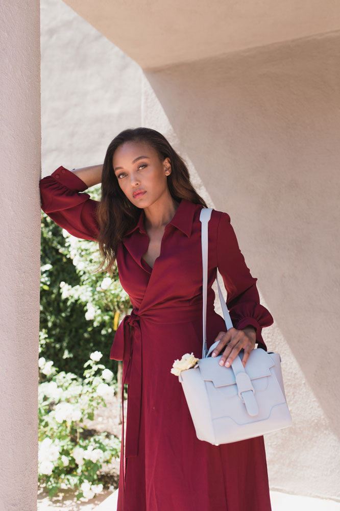 Woman with Blue Handbag