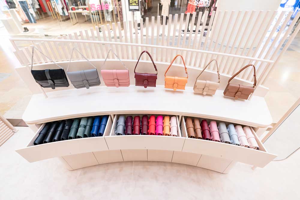 Handbags in Multiple Colors on Shelf