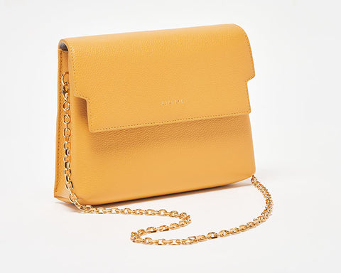 minimalist designer flap bag in yellow